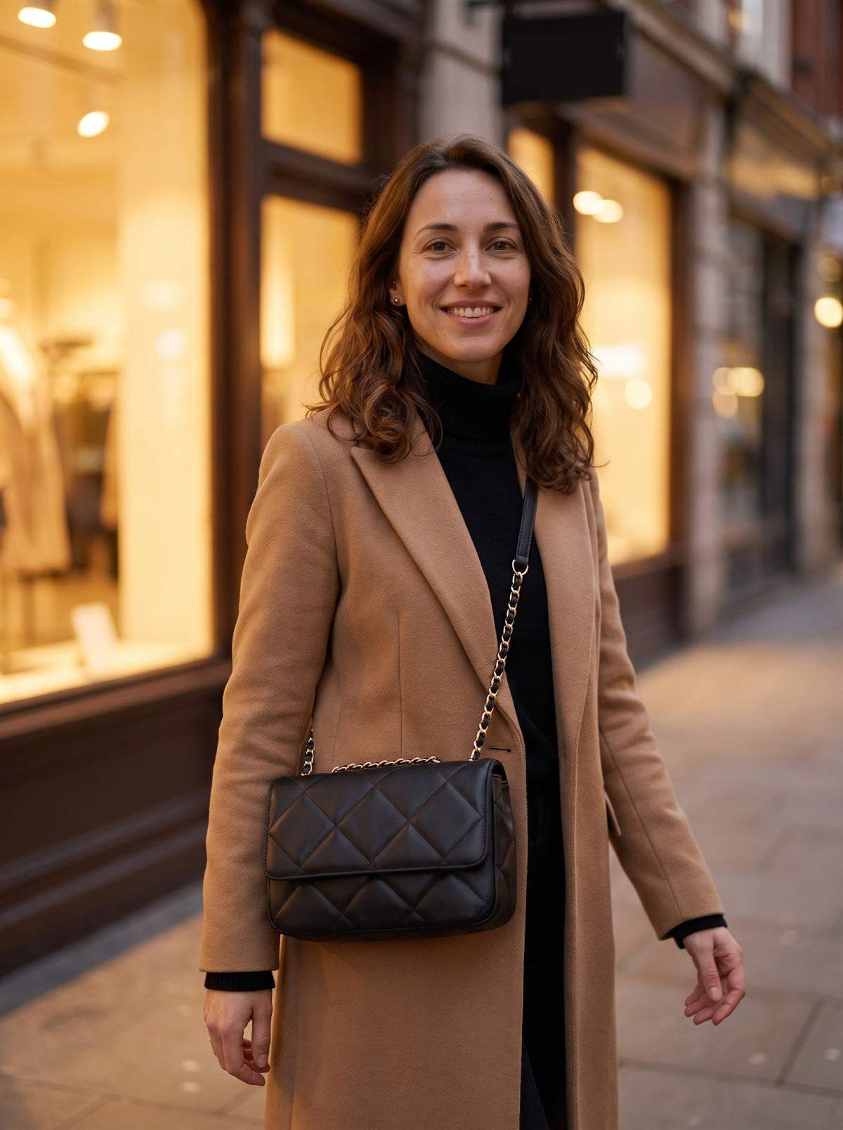 Woman wearing the black Quilted Crossbody Bag across her body