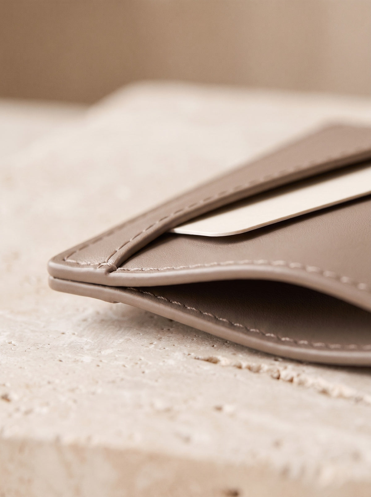 Close-up of the card slots and edge stitching of the taupe Slim Card Holder